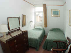 Bedroom of self catering flat with twin beds